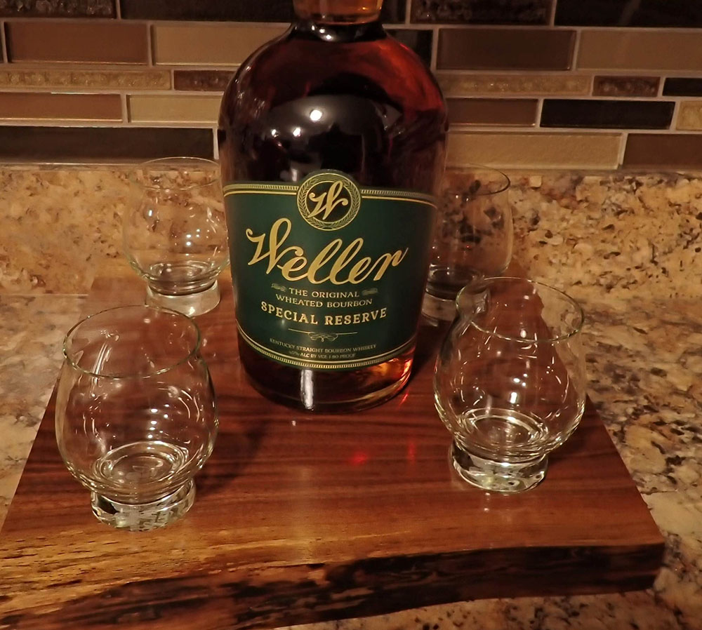 board with bottle and 4 glasses